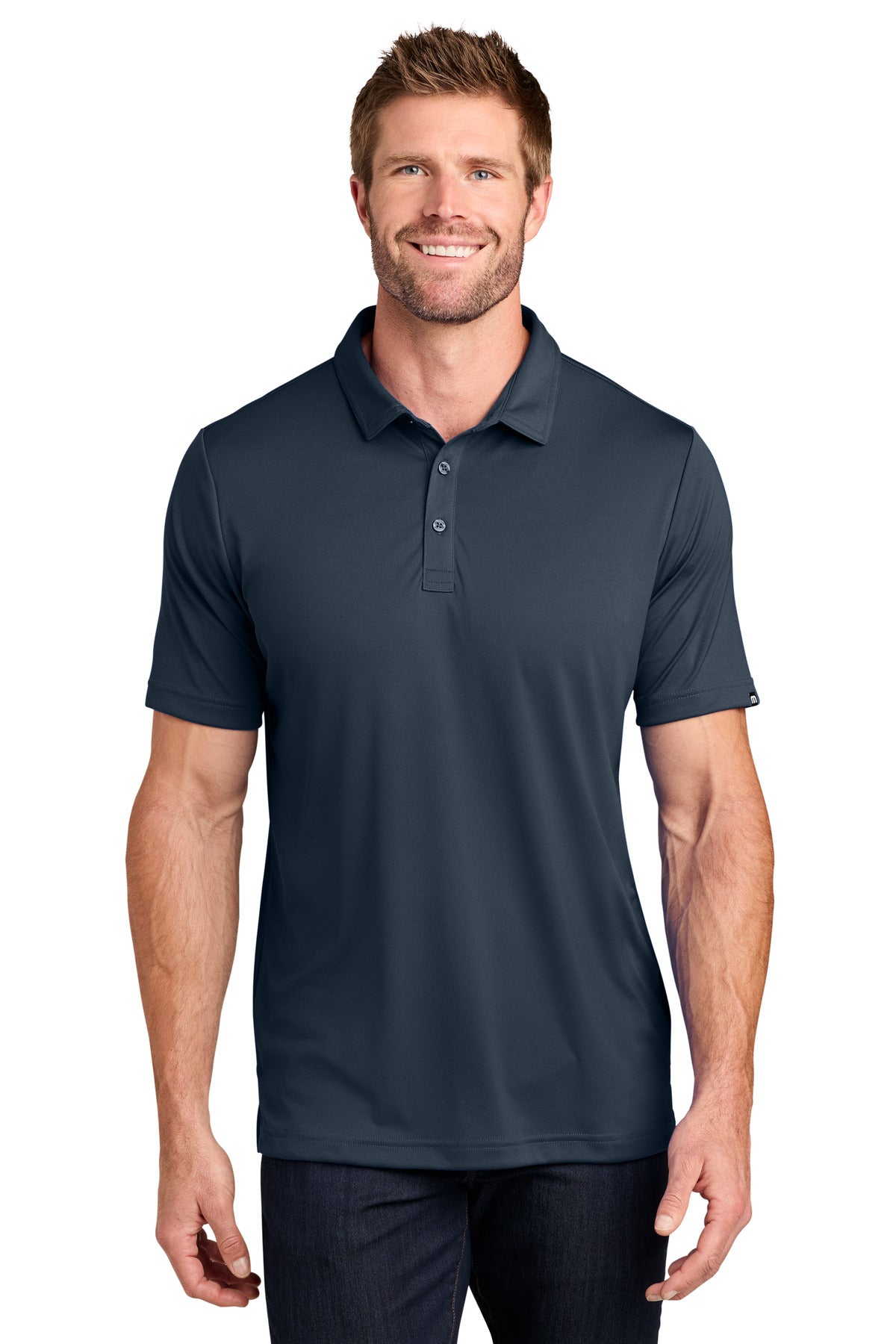 TravisMathew Coto Performance Polo. TM1MU410 - EMBROIDERED
