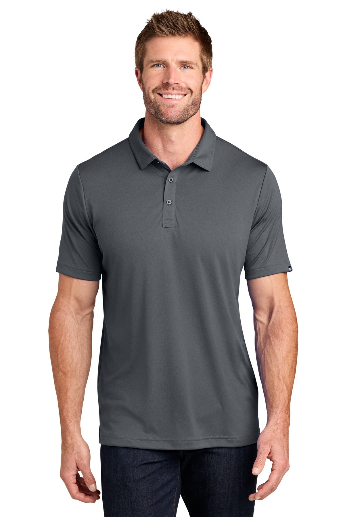TravisMathew Coto Performance Polo. TM1MU410 - EMBROIDERED
