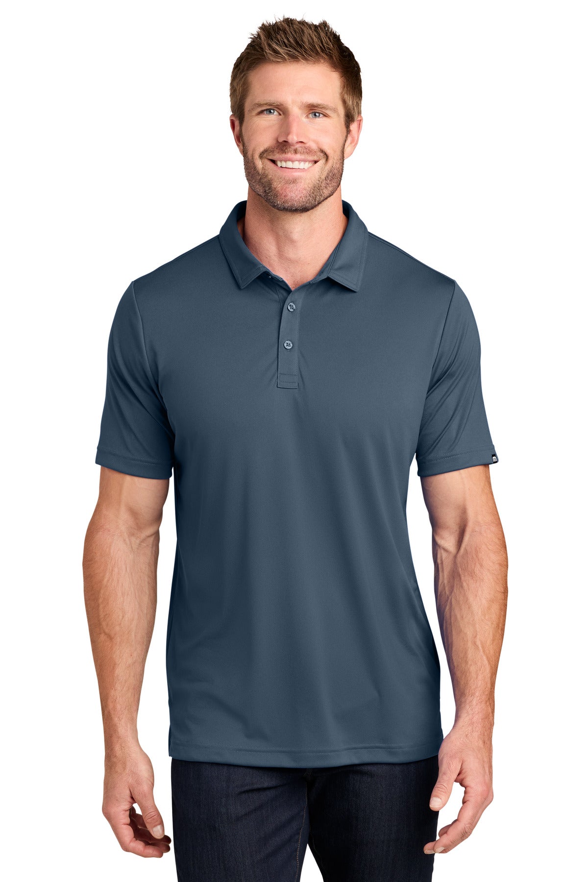 TravisMathew Coto Performance Polo. TM1MU410 - EMBROIDERED